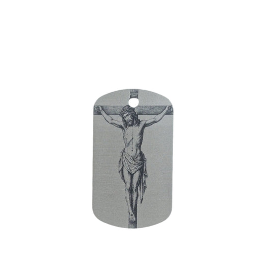 Dog tag with a black and white illustration of Jesus on the cross on a light gray background