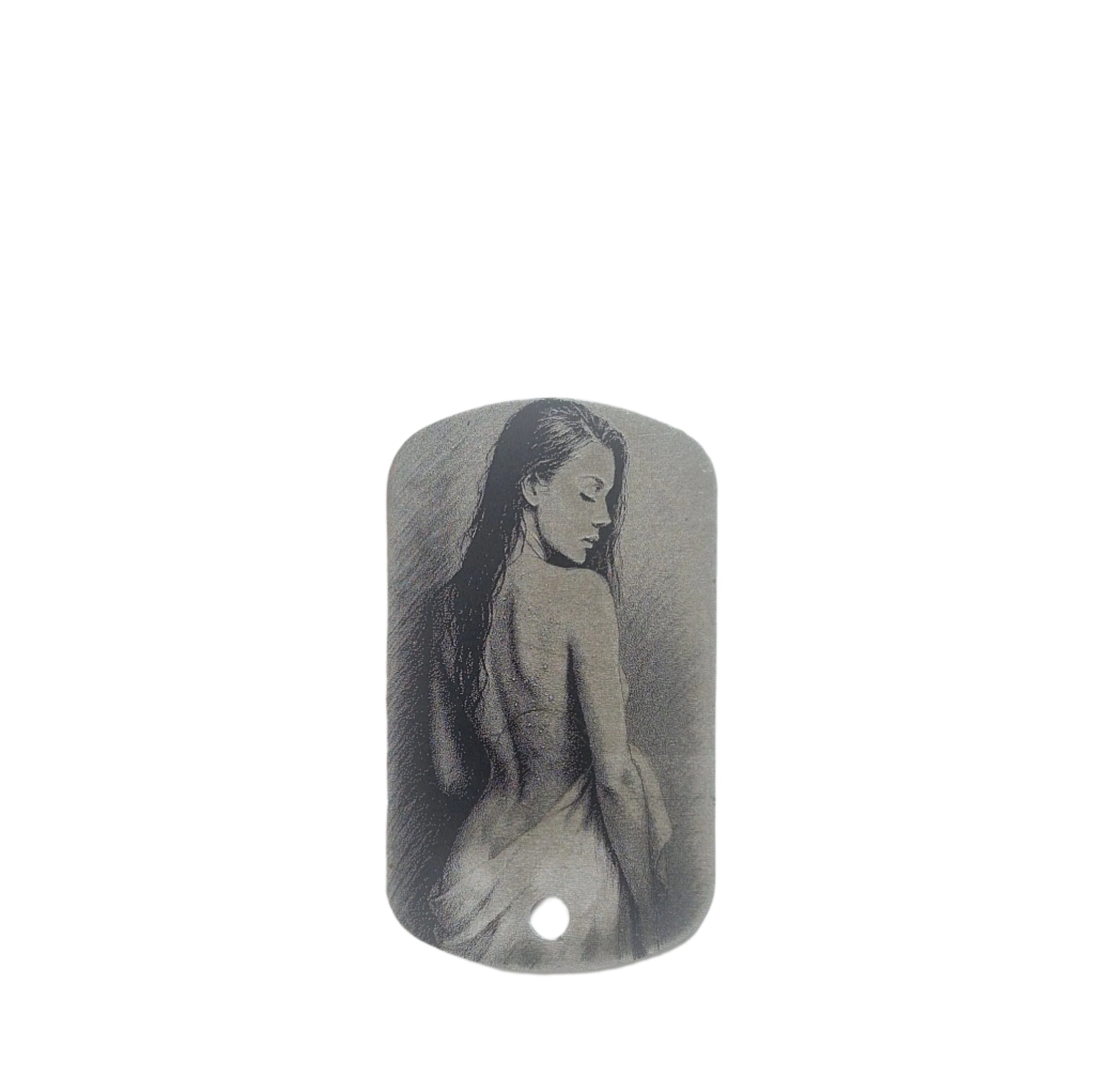 Metal dog tag with engraved image of a woman on a white background